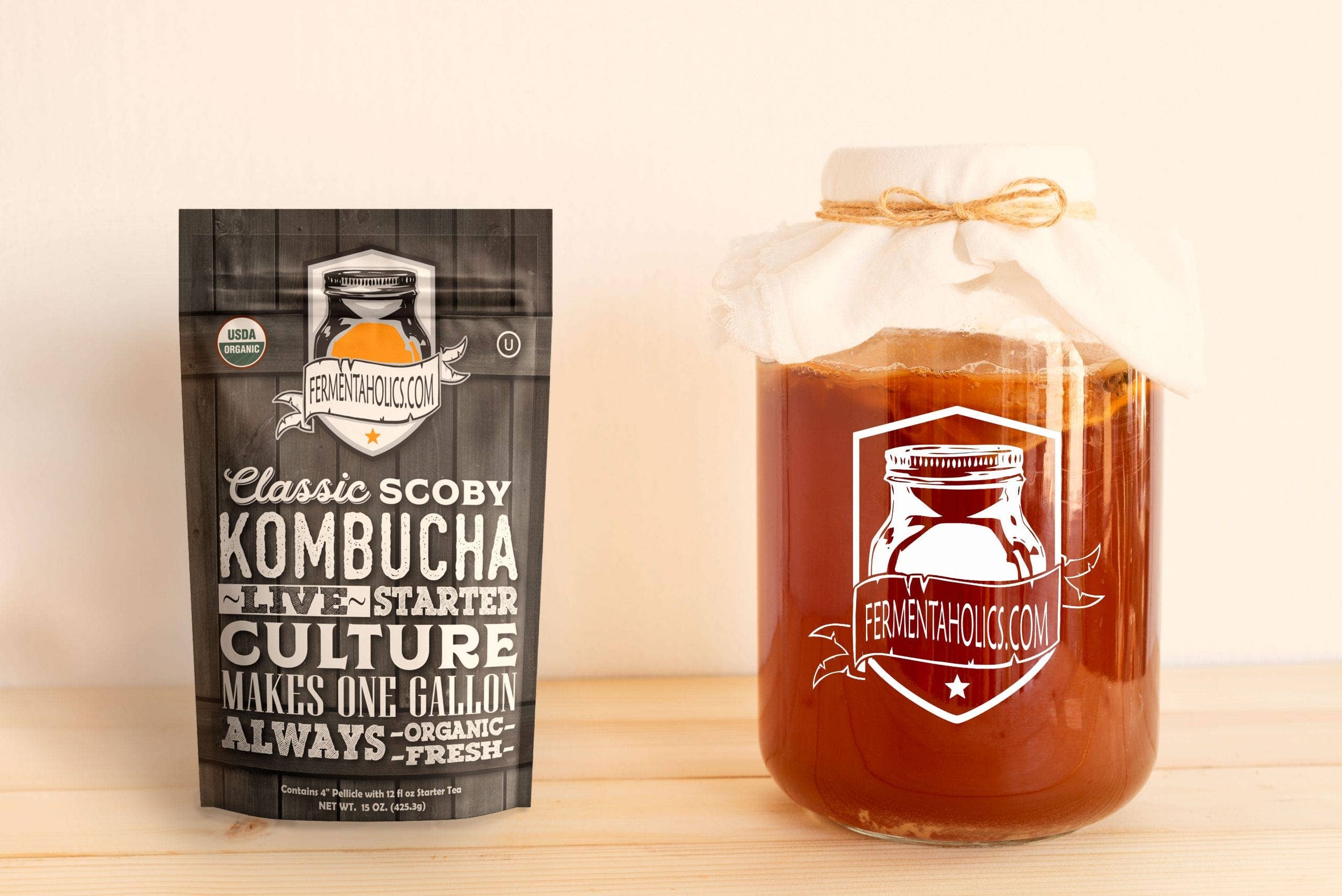 Picture of the back of kombucha with a glass jar next to it. 