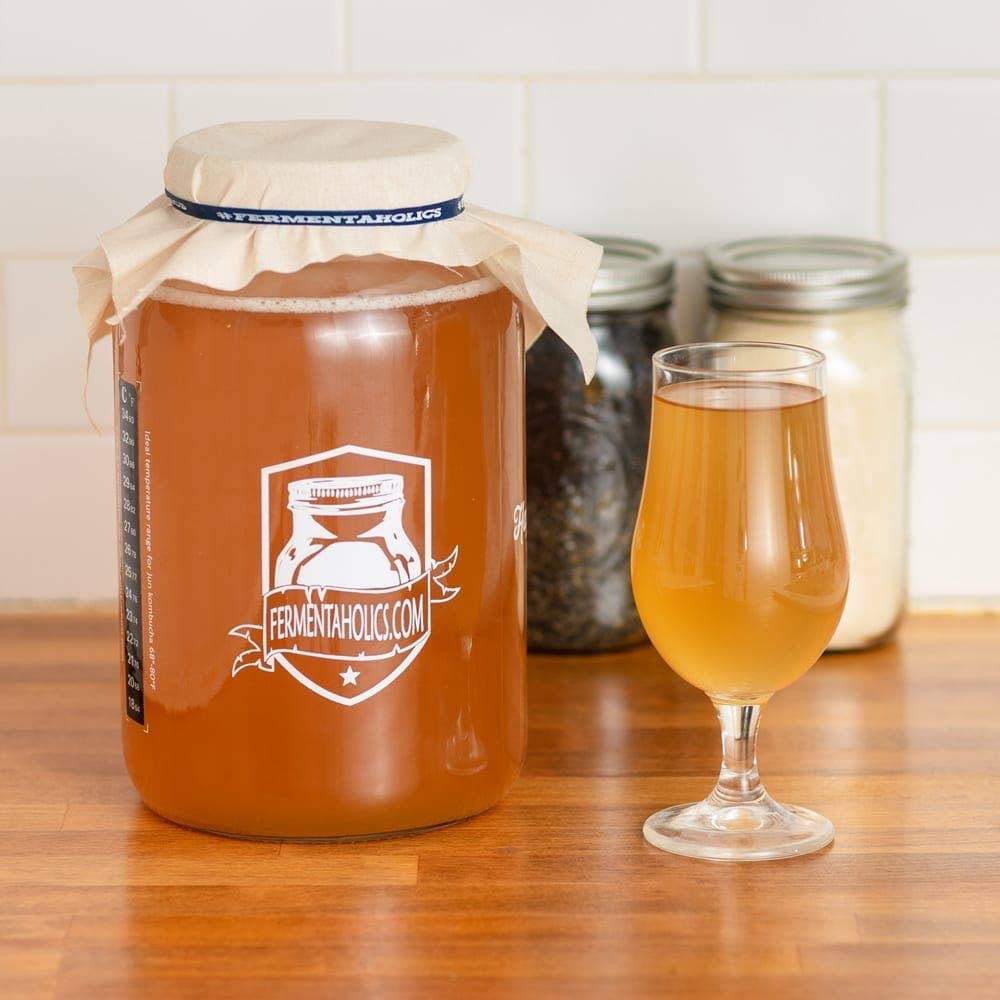 Picture of kombucha being fermented in a jar